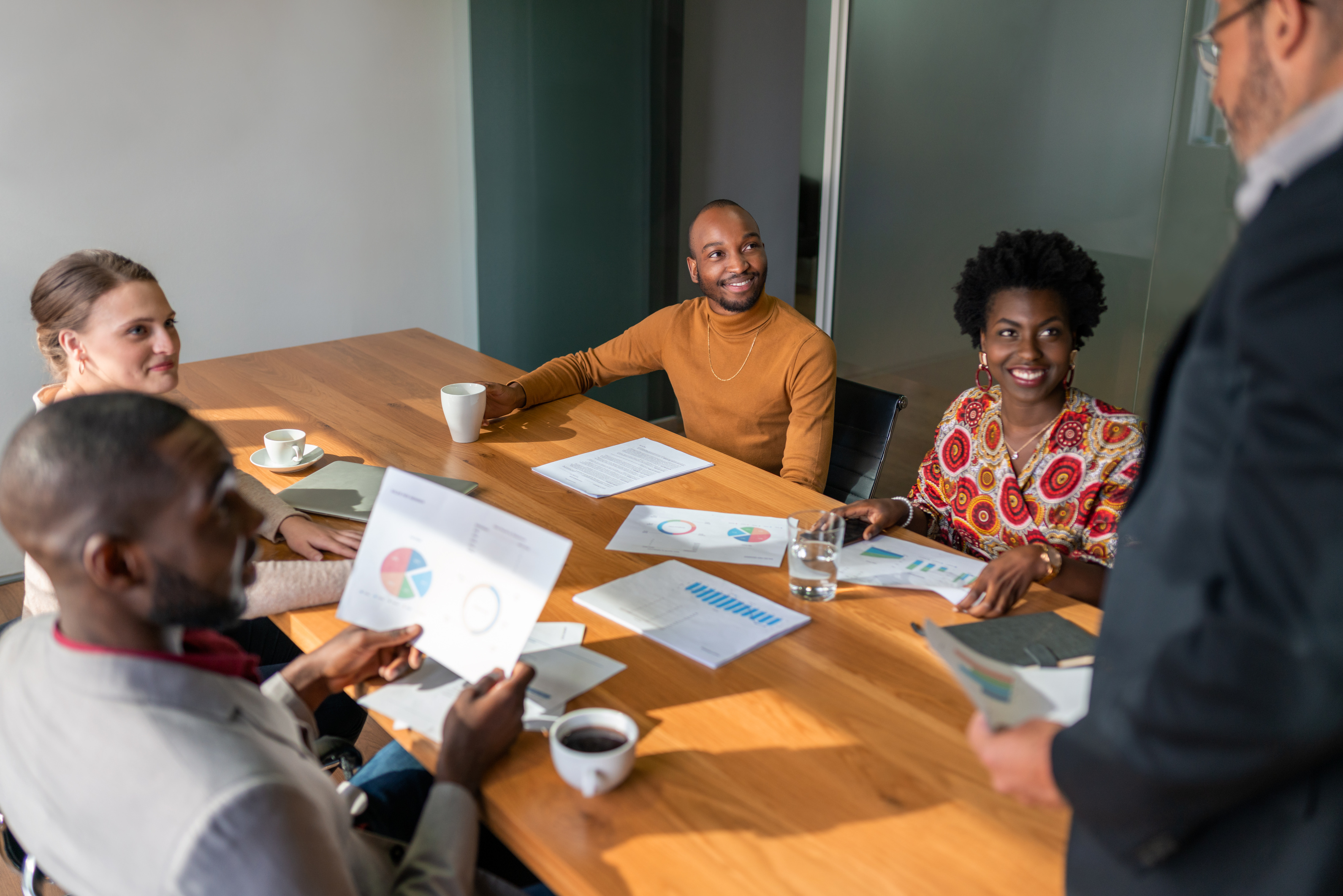 Professionals collaborating around a meeting table